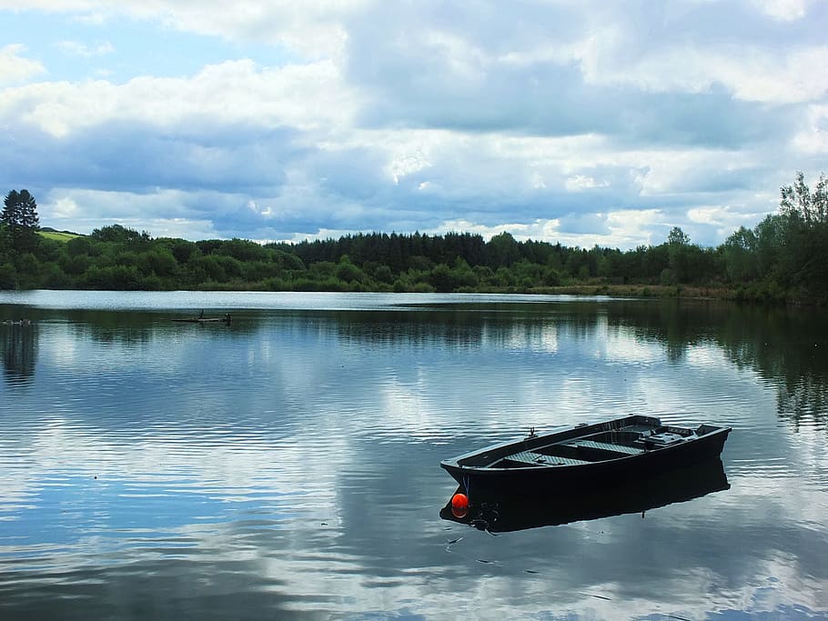 jon boat on lake under white clouds, sky, reflections, blue, landscape