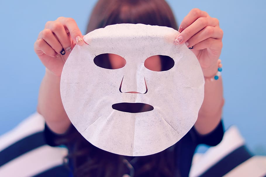 person holding a face mask, mask - Disguise, people, human Face HD wallpaper