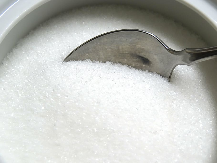 stainless steel spoon scooping sugar, cutlery, sweeteners, food