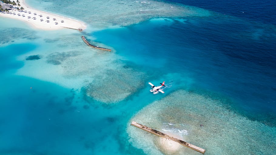 top view of white plane on body of water, white plane on body of water during daytime HD wallpaper