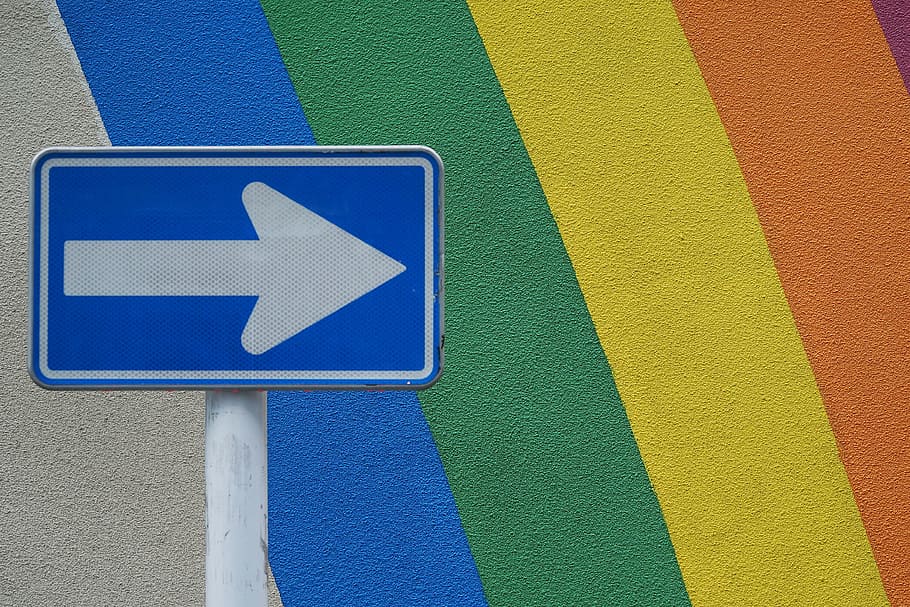 white and blue arrow signage near painted wall, road Sign, street HD wallpaper