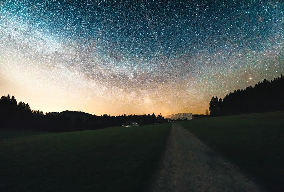 gray road under the night sky, pathway between grass field during sunset HD wallpaper