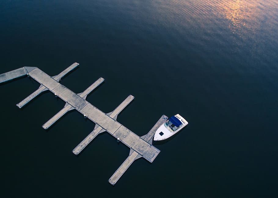 white yacht near dock on body of water, boat beside gray dock during daytime HD wallpaper