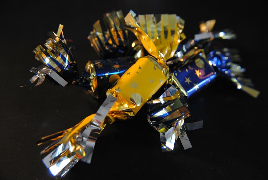 macro, candy, paper, black background, robot, no people, indoors HD wallpaper