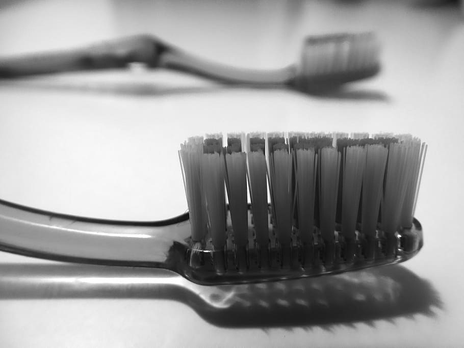 close-up photo of toothbrush, bristles, dental care, clean, fork