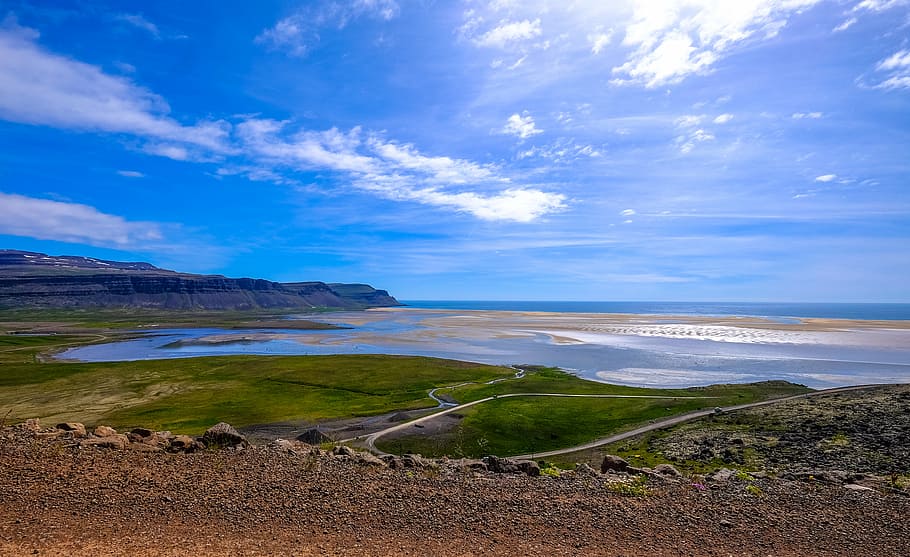beach, cliff, clouds, daylight, grass, island, landscape, nature HD wallpaper