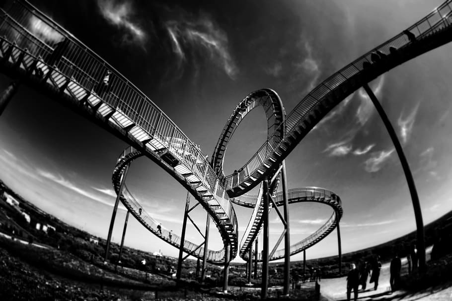 grayscale photo of bridge, rollercoaster, looping, amusement