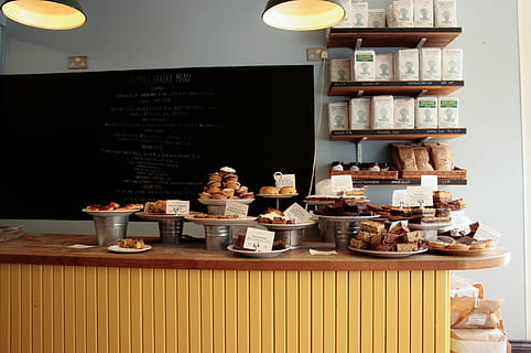 baked pastries on wooden desk, assorted, breads, brown, table HD wallpaper