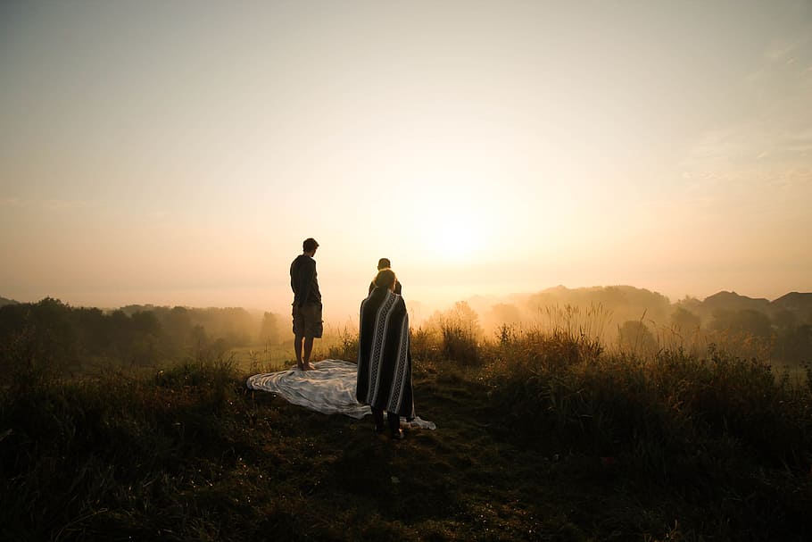 photo of two persons on hill during golden hour, man standing on hill HD wallpaper
