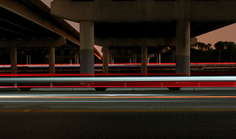 timelapse photography of vehicle light crossing on road under concrete dock, time lapse photo under the bridge HD wallpaper