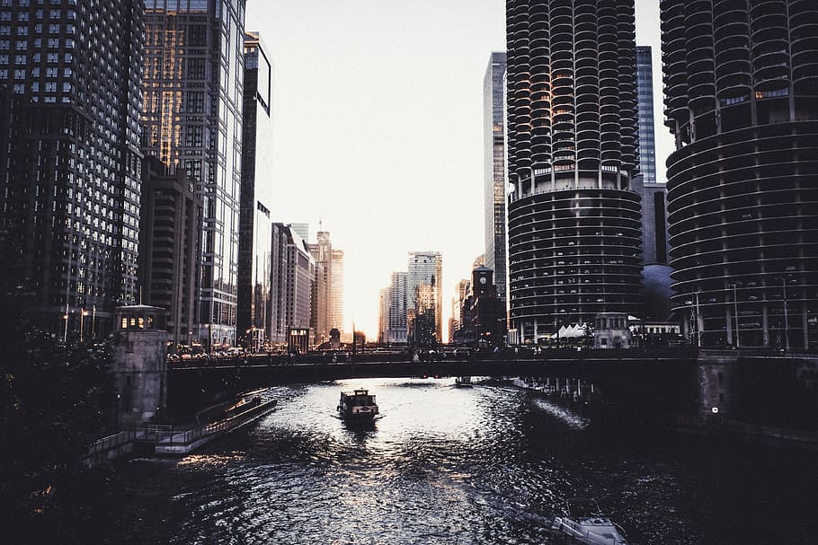 black bridge during daytime, photo of body of water between high rise buildings HD wallpaper