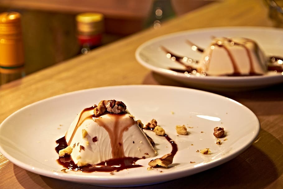 closeup photography of dessert on plate on table, desserts, pannacotta