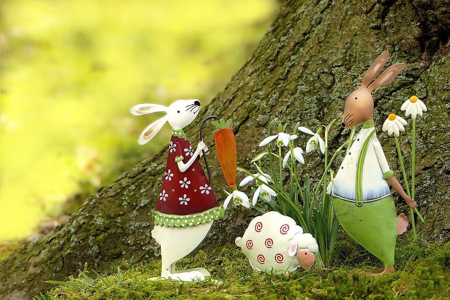 close up photo of two rabbits and one sheep decor under tree HD wallpaper