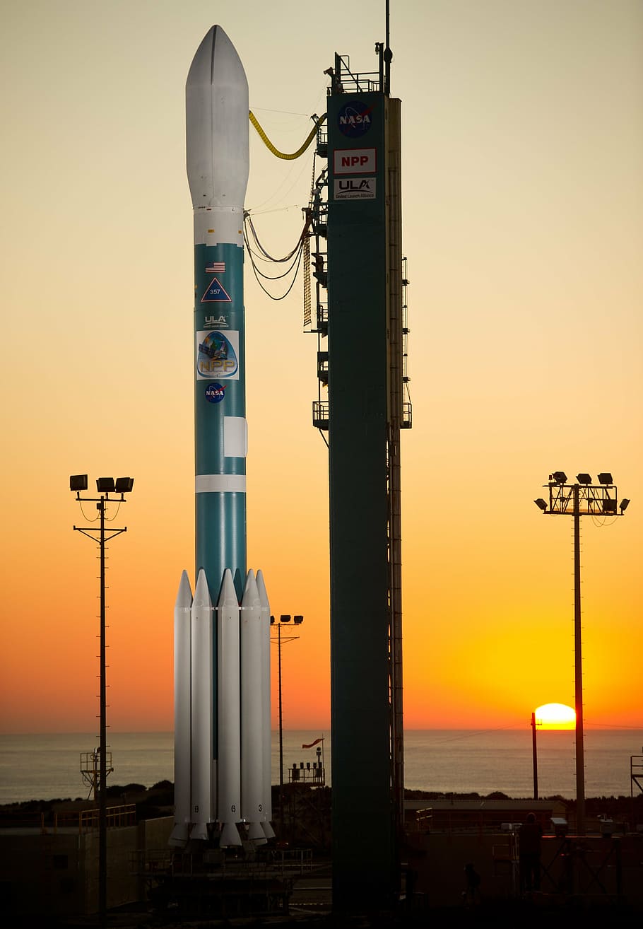 delta two rocket, weather satellite, payload, launch pad, dusk HD wallpaper