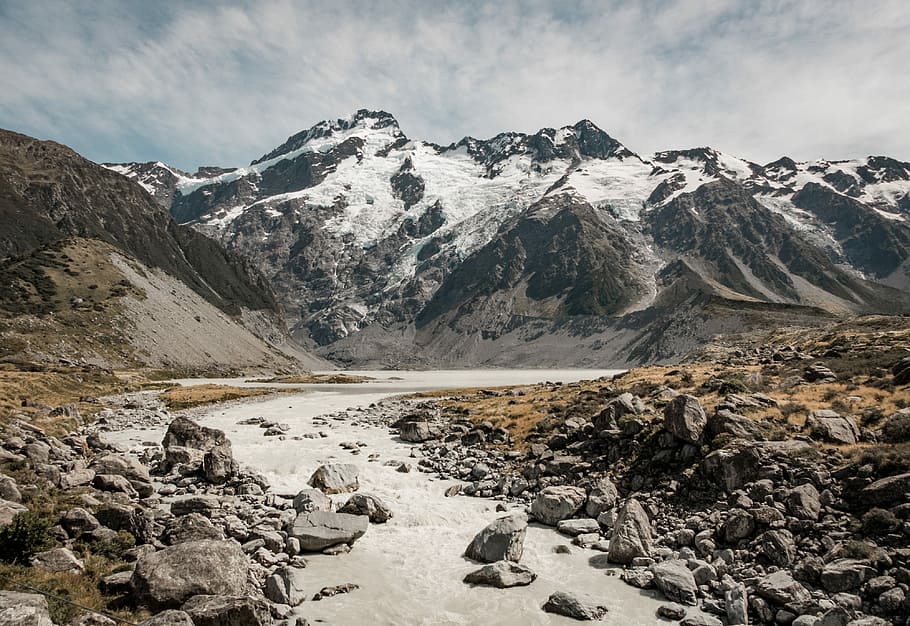 river and rock mountain with snow during daytime, concrete road block by rock photo graphy HD wallpaper