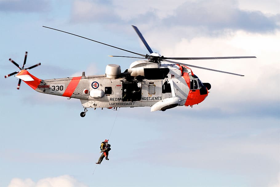 person hanging under the helicopter, norway, pilot, rescue, rescue man