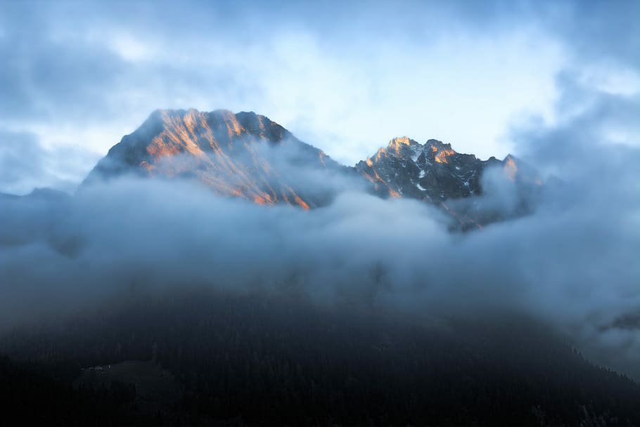 time-lapse photography of mountain surrounded by cloudes, landscape photography of brown mountain HD wallpaper