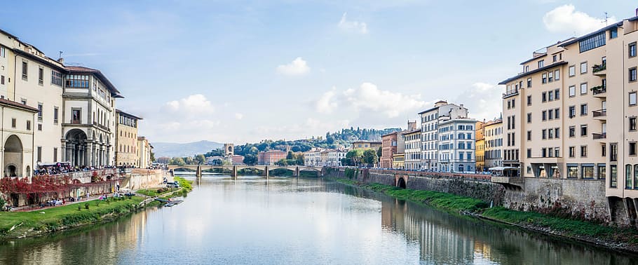 body of water in between buildings during daytime, florence, italy