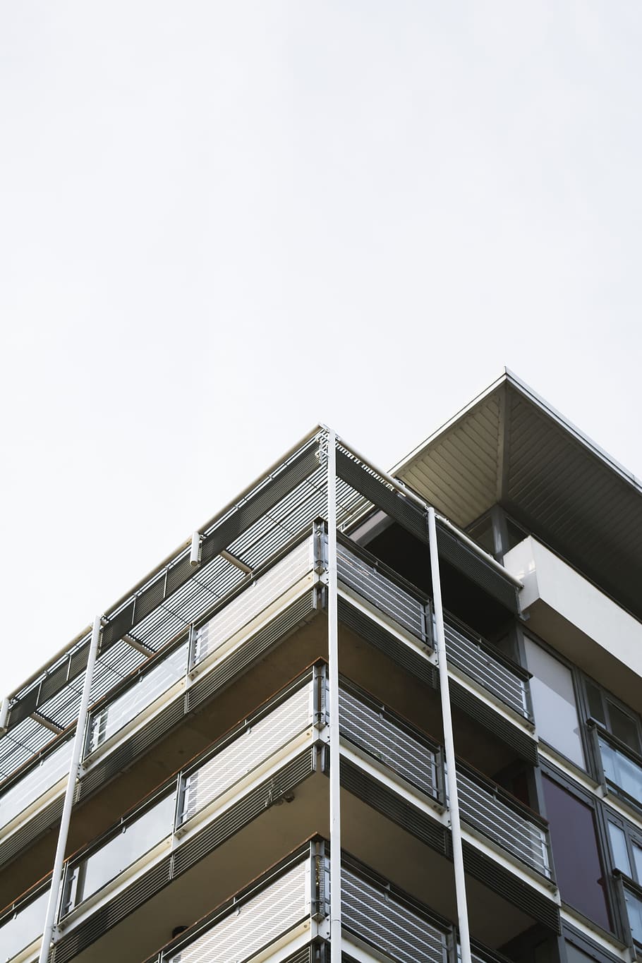 white and black concrete building, worm's eye view of building HD wallpaper