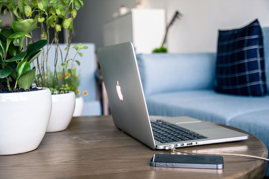 MacBook Air near space gray iPhone 5s on top of the table, apple HD wallpaper