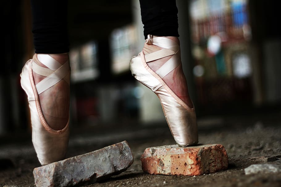person wearing gold ballerina shoes, selective focus photography of ballerina stand on concrete bricks, HD wallpaper