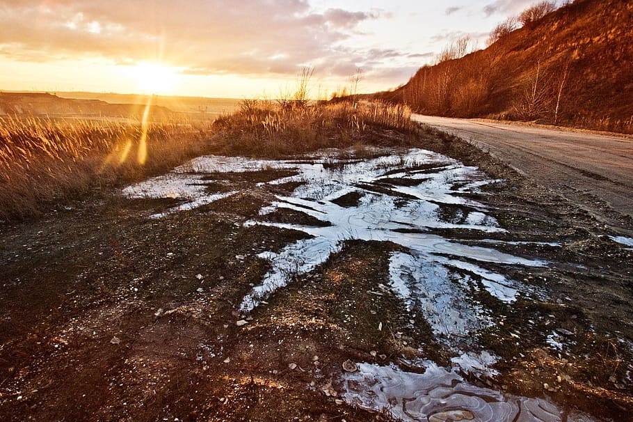 sky, clouds, sunsets, sunshine, sunrays, road, fields, water HD wallpaper