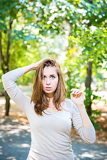 woman putting her right hand on her head, tree, hands, figure HD wallpaper