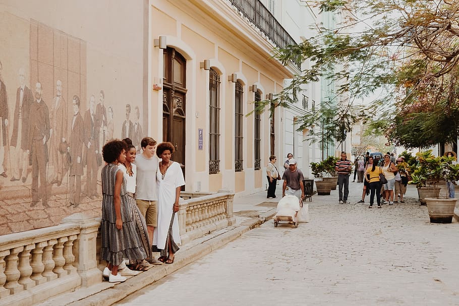 group of people standing near wall, people in the city at daytime HD wallpaper