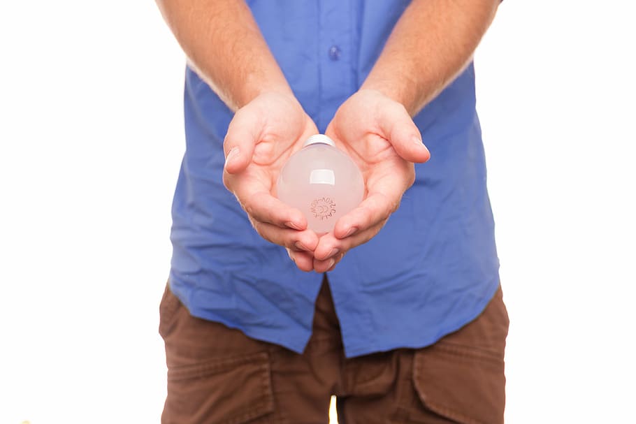 person holding light bulb, lamp, idea, offering, pear, view HD wallpaper
