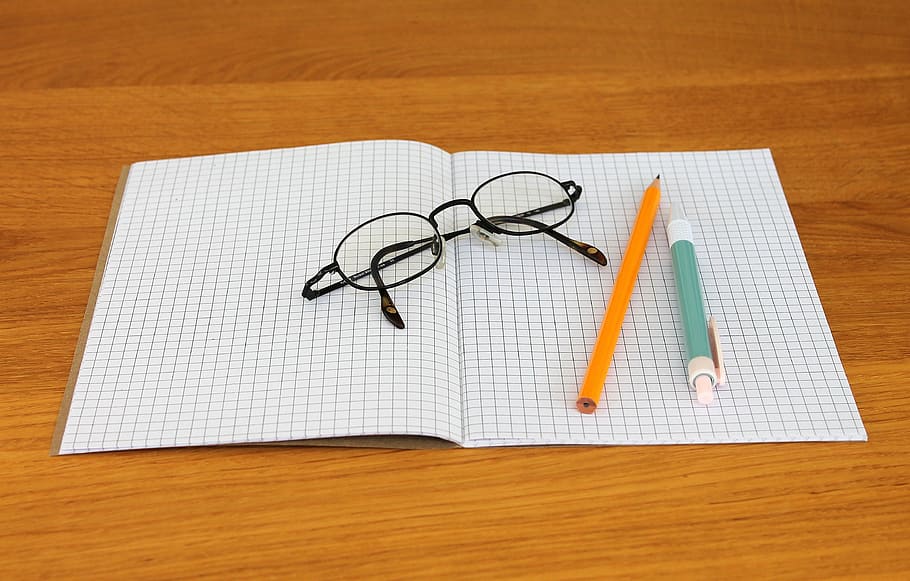 eyeglasses on paper near pencil, note, notebook, writing implements HD wallpaper