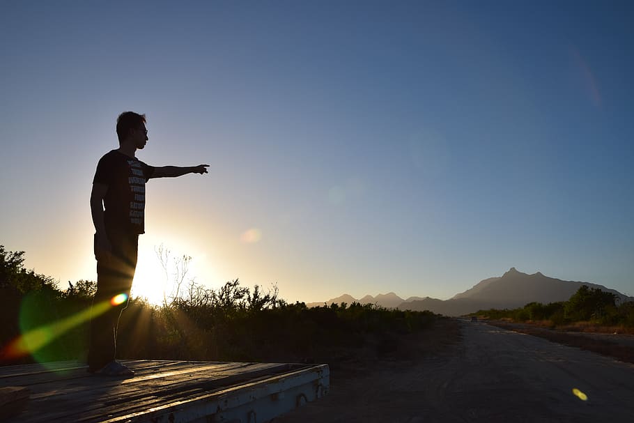 man standing during sunset, sunlight, shadow, mexico, finger pointing HD wallpaper