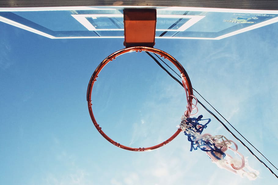 low angle view of red basketball rim and board, low angle photograph of basketball rim