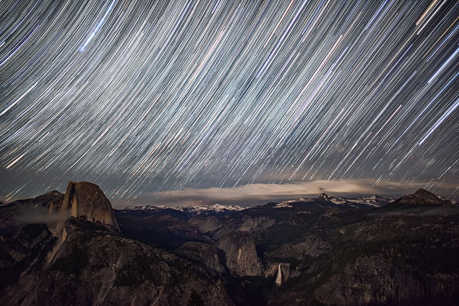 time lapse of brown mountain with a scene of meteorites, sky HD wallpaper