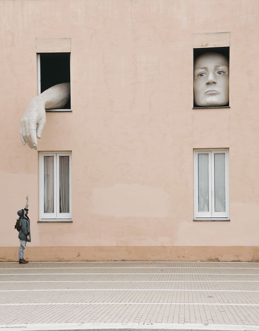 person raising hand under the window, person looking up pointing at top HD wallpaper