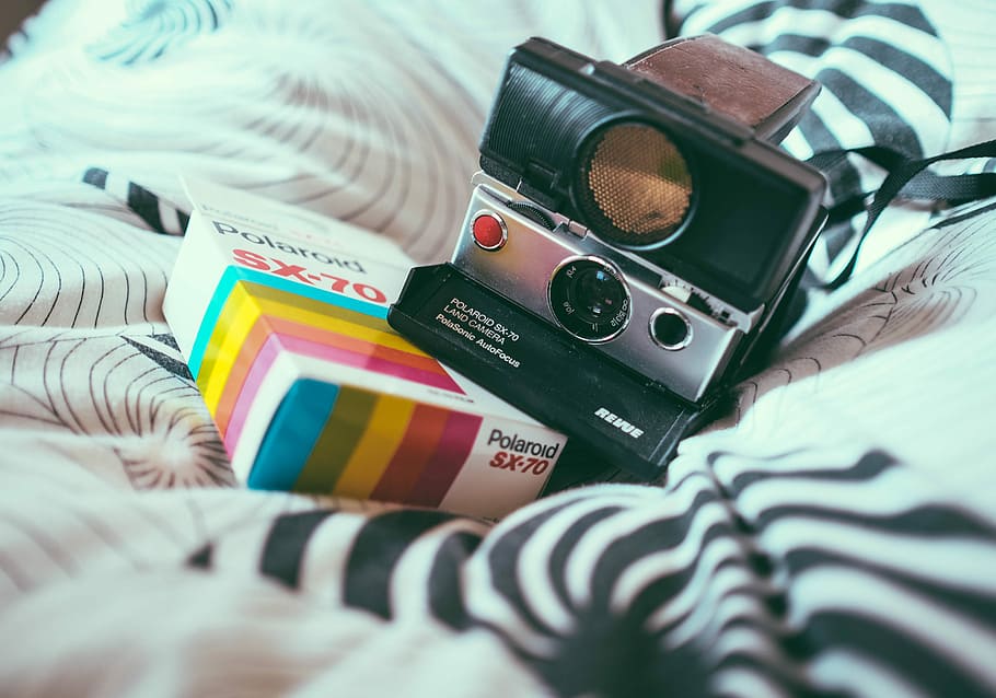 HD wallpaper: black and gray Polaroid land camera, instant camera on bed, blanket - Wallpaper Flare