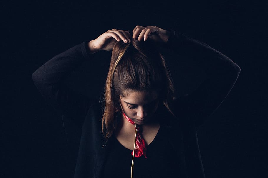 woman tying hair with both hands, woman tying her hair, woman in black HD wallpaper