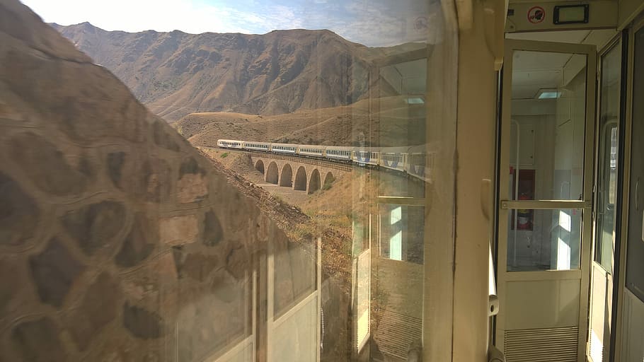 white concrete house near mountain, window view of white train over bridge HD wallpaper