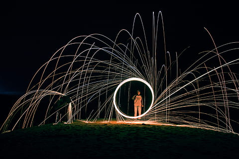 time lapse photo of person on shore, fire dancing still wool photography HD wallpaper