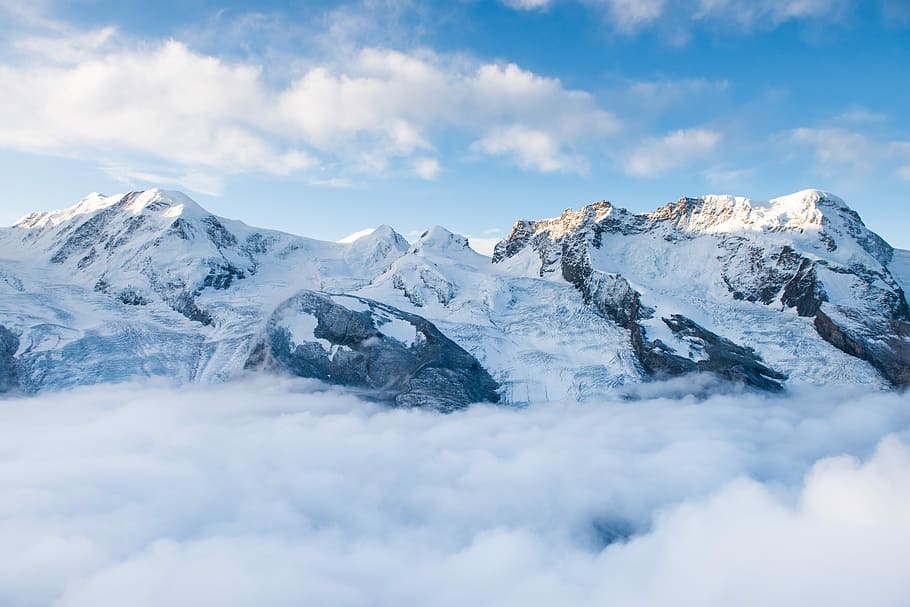 snow-capped mountain with sea of clouds, mountain covered by snow under blue sky during daytime HD wallpaper