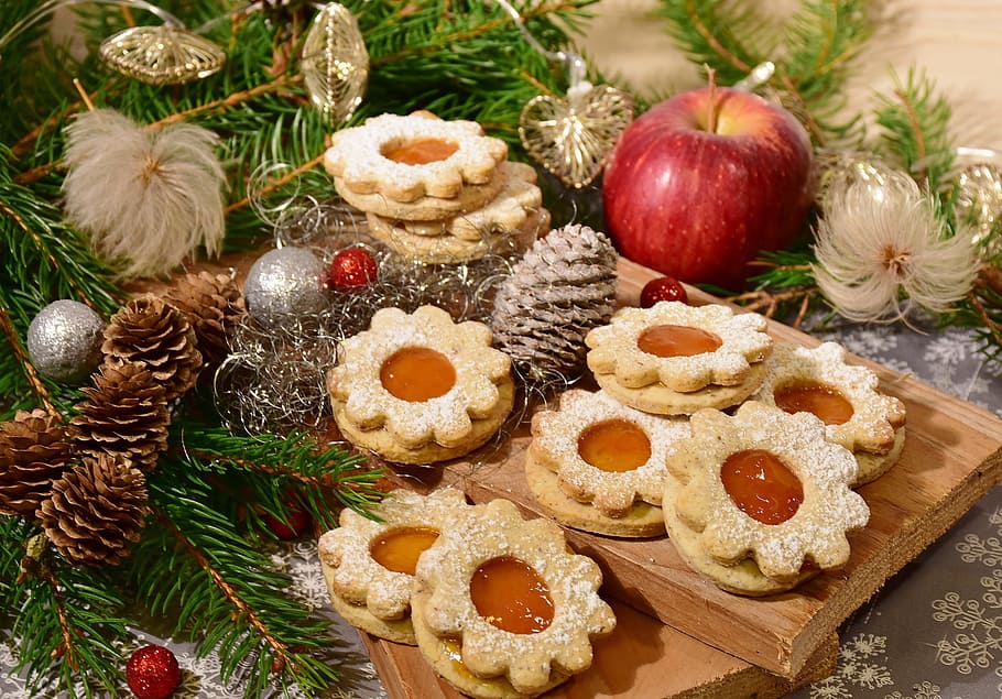 biscuits in brown wooden tray near ripe apple, cookie, christmas cookies