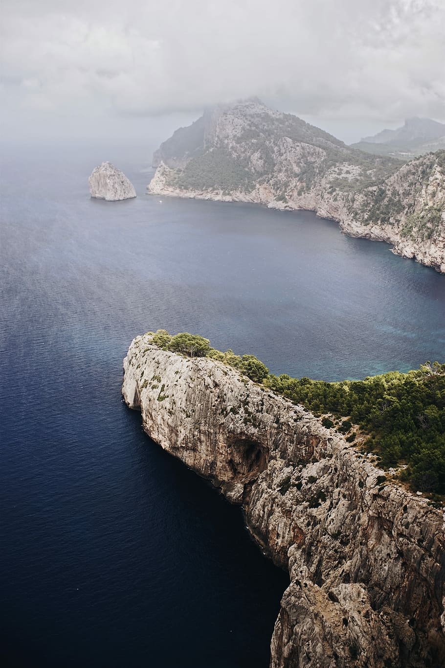 aerial photo of gray rocky islands beside body of water during daytime, aerial photo of and islands HD wallpaper