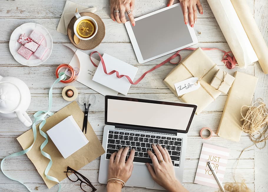 flat lay photography of person using MacBook and iPad near papers and strings HD wallpaper