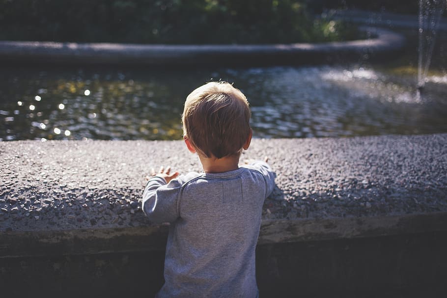 boy standing near outdoor fountain, people, arms, back, child HD wallpaper