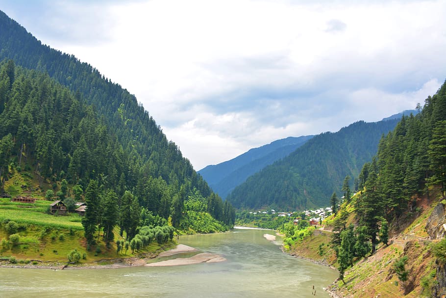 river with trees on the side during daytime, beautiful pakistan
