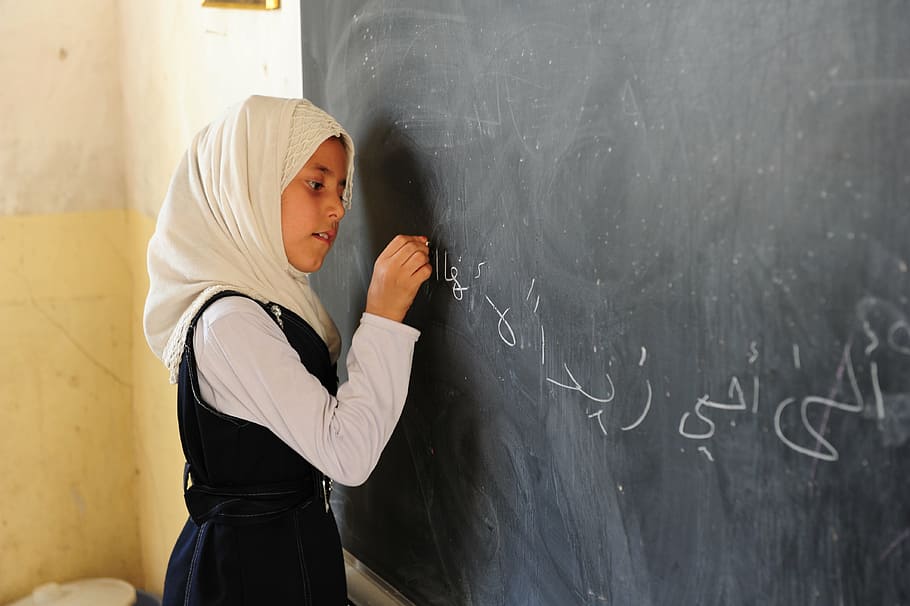 girl writing on chalkboard, child, student, bebel, iraq, school