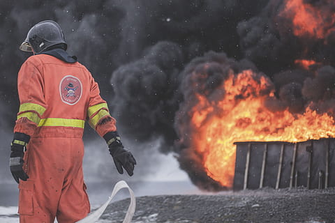 fireman wearing firesuit, firefighter near burning premises, hot HD wallpaper