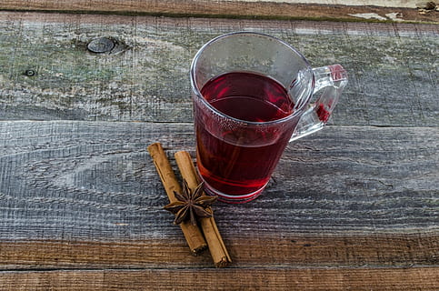 clear glass mug with red liquid, tea, cup, teabag, close-up HD wallpaper