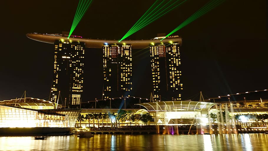 landscape photography of a city with lights and three high-rise buildings HD wallpaper