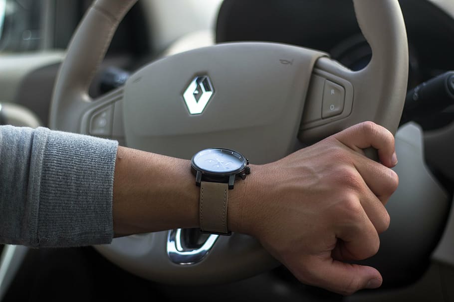 person holding gray Renault steering wheel, car, clock, mvmt HD wallpaper