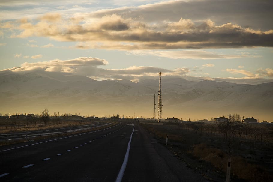 winding road under cumulus clouds, silhouette photo of asphalt road HD wallpaper